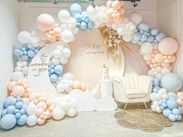 Balloon display with baby shower themed backdrop