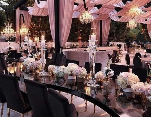 Black and pink themed outdoor event dining setup