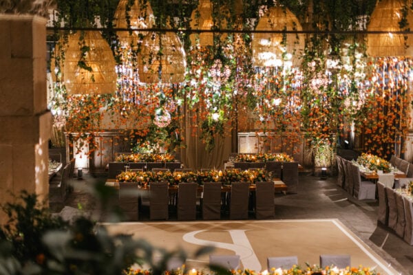 Event venue with florals and plants hanging from the ceiling