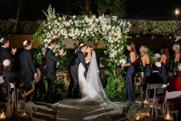 couple kissing at wedding ceremony